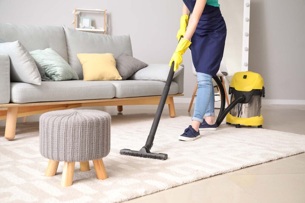 woman-doing-cleaning-the-house-with-a -vacuum